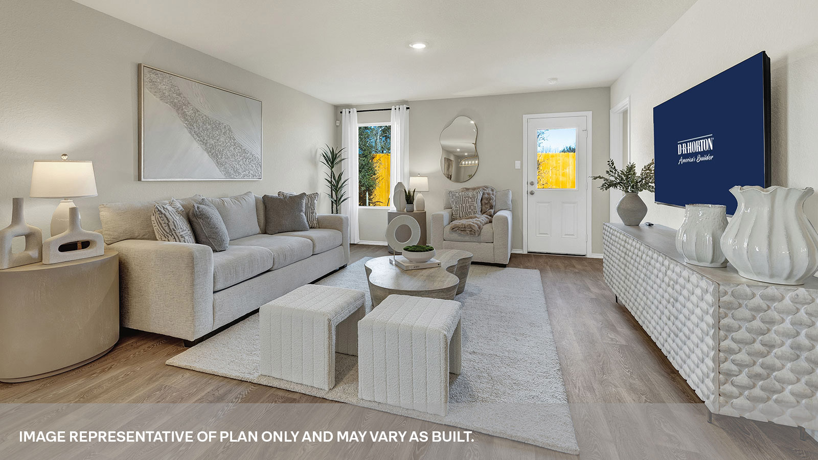 Living room showing one of two windows and the door to the back yard