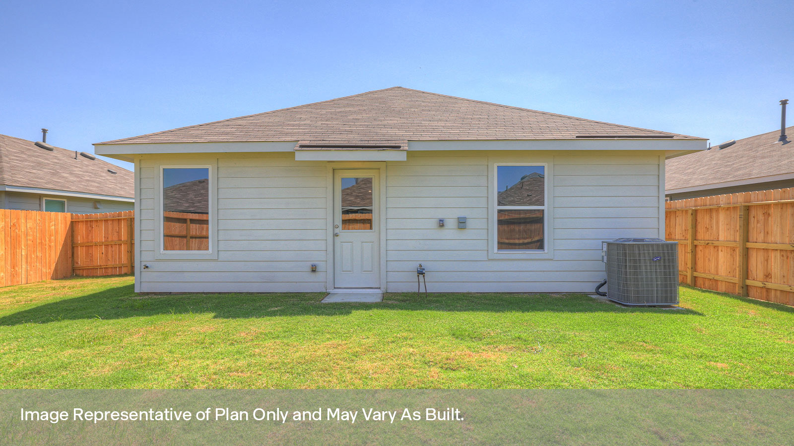 Backyard with 2 windows, and a half lite exterior door.