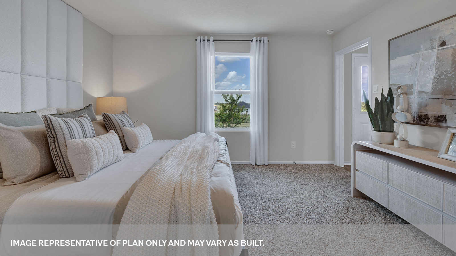 Main bedroom with carpeting and one window.