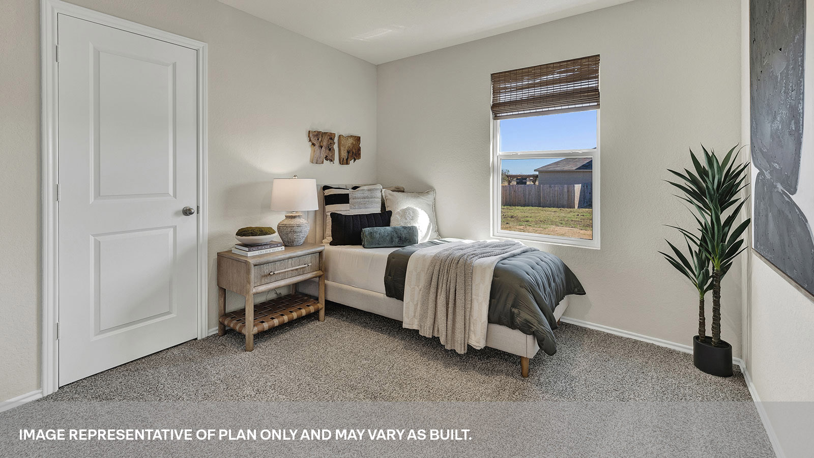 Bedroom with carpeting and one window.