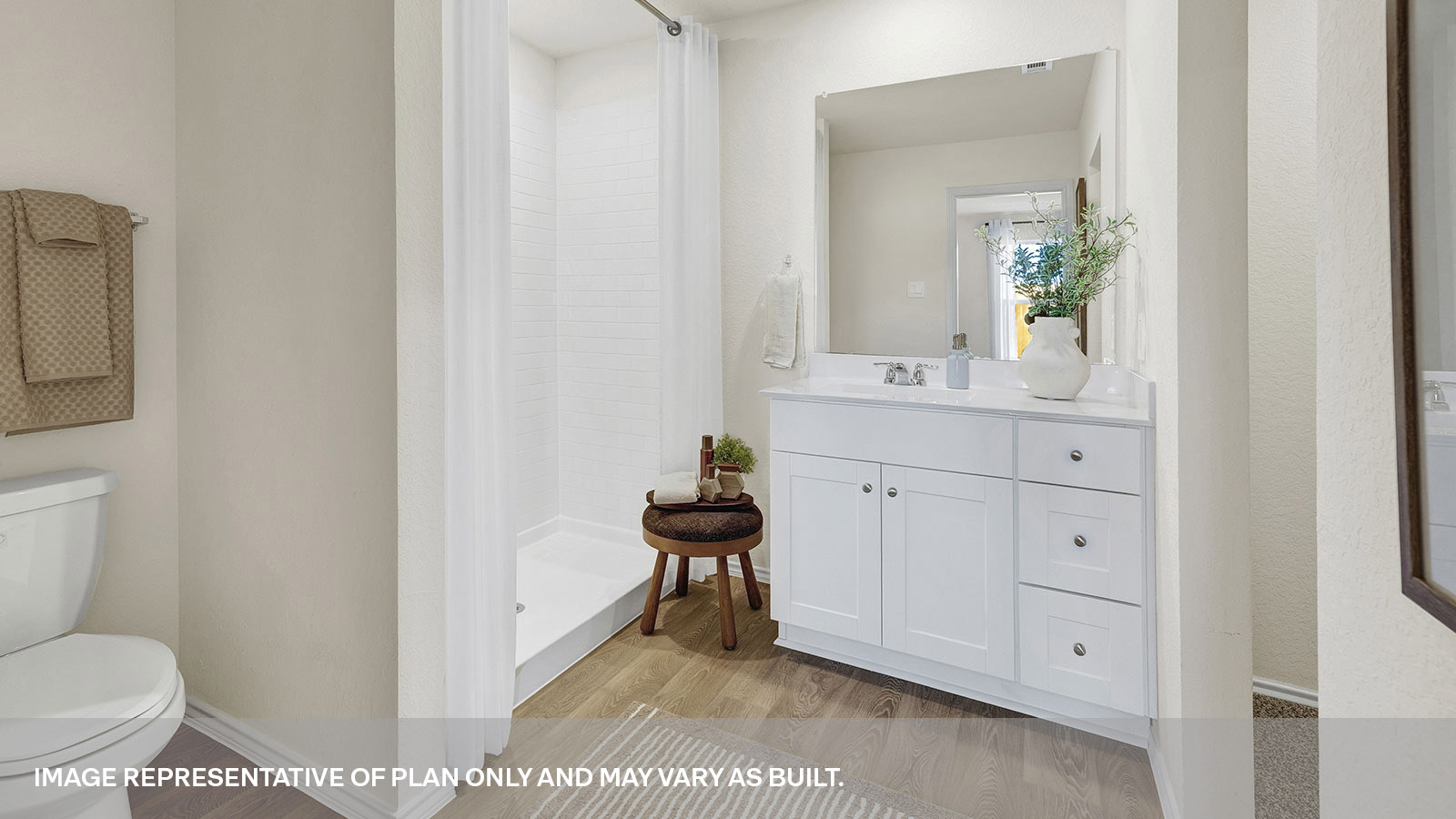 Main bathroom with shower, toilet, and sink.