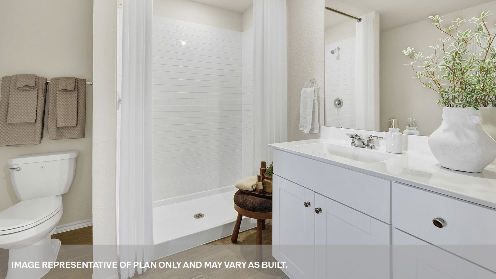 Main bathroom with shower, toilet, and sink.