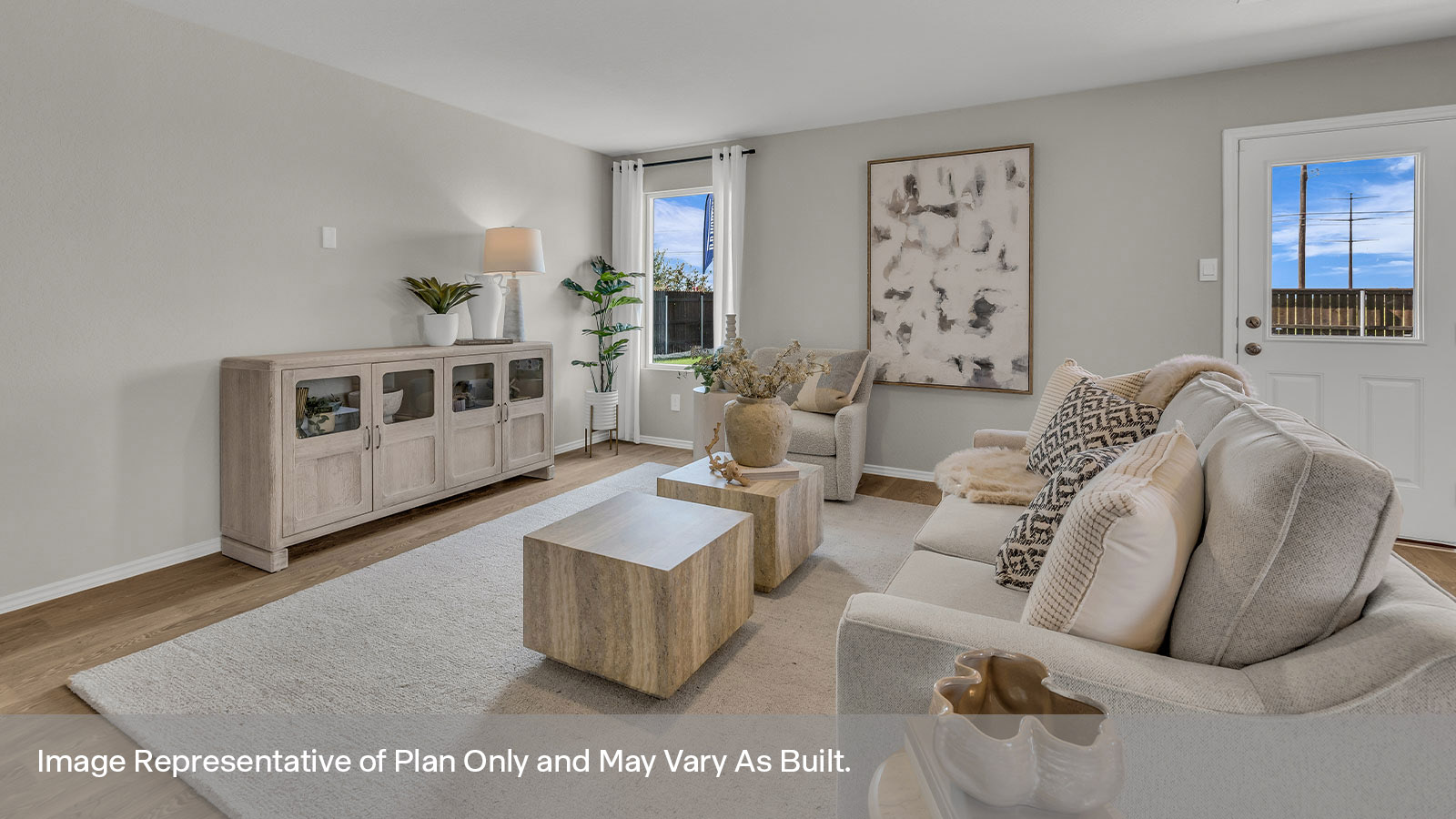 Living room with vinyl flooring, one window, and a half lite exterior door.