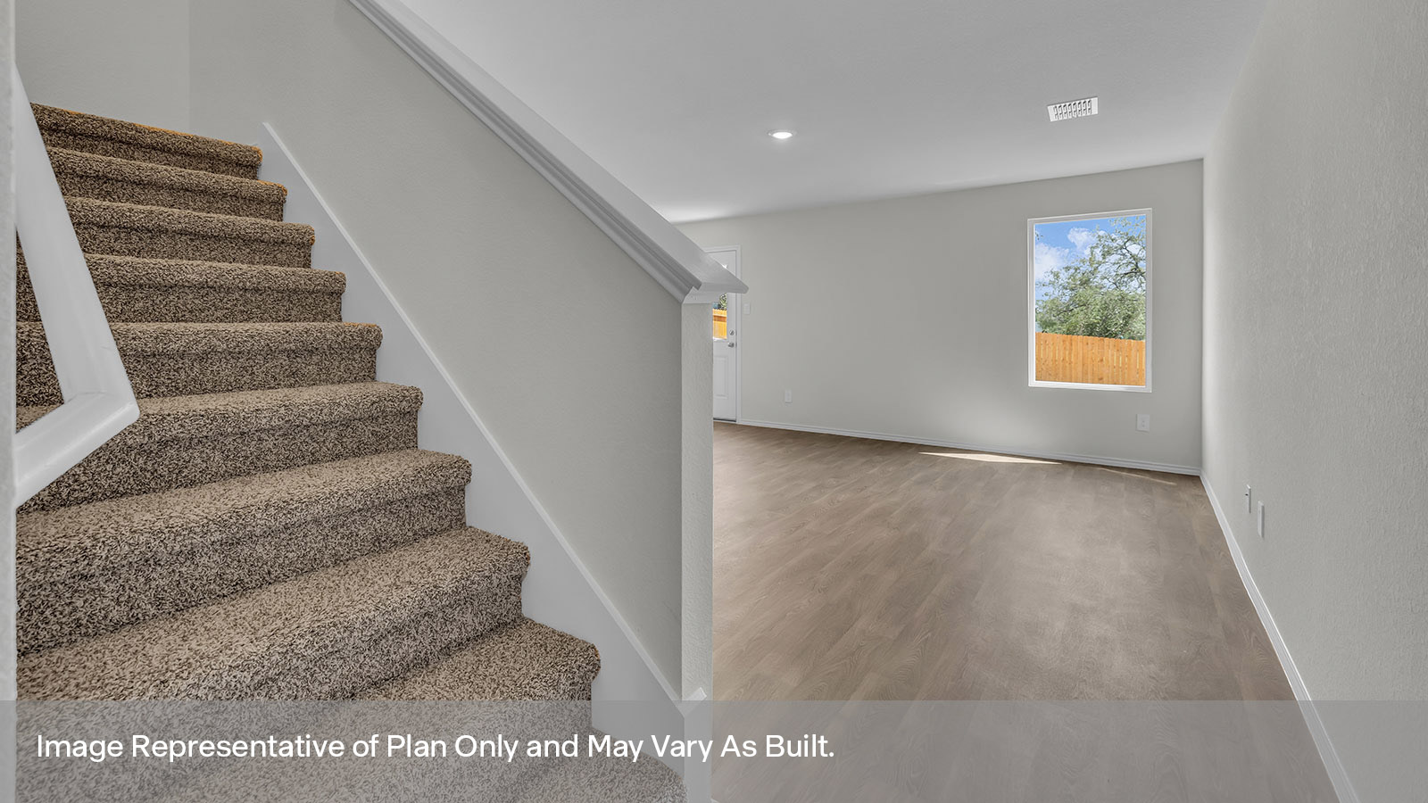 Entry hallway showing staircase and entering the living room.