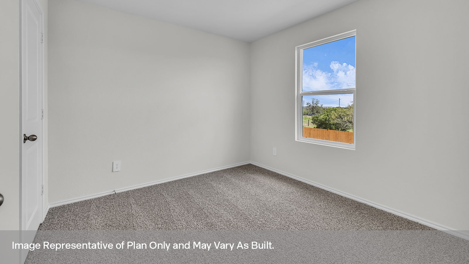 Secondary bedroom with carpeting and one window.