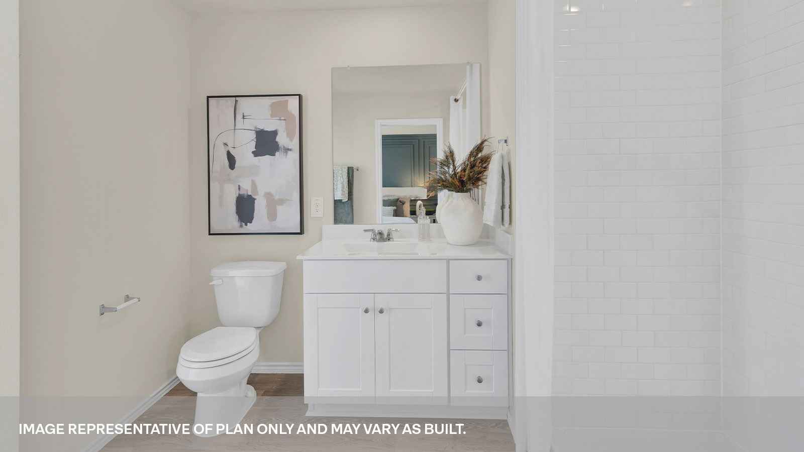 Main bathroom with toilet, vanity and shower.
