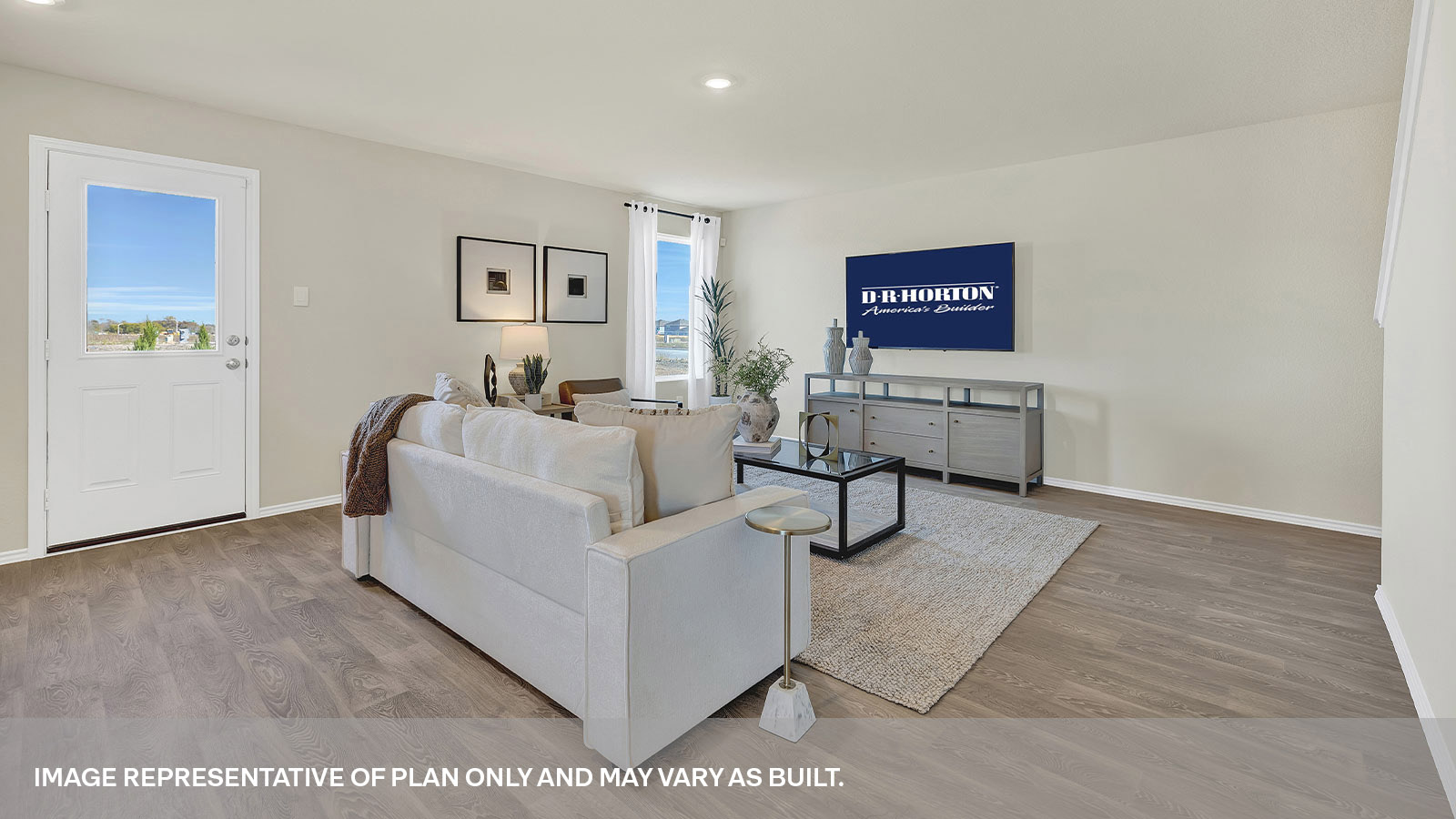 Living room with vinyl flooring with one window and a half lite exterior door.