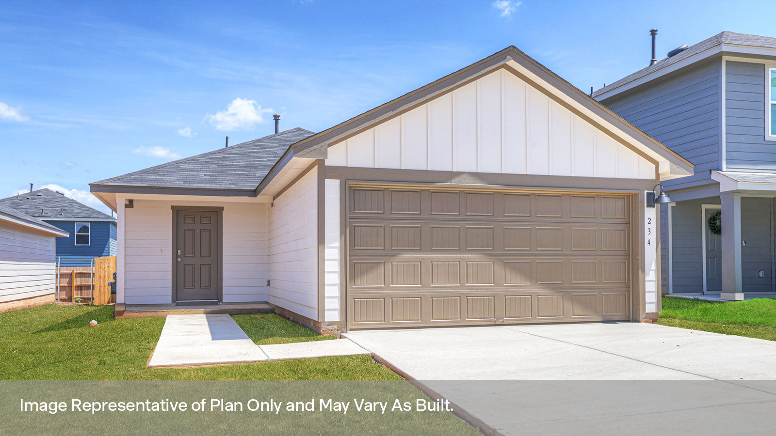 Single-story farmhouse exterior with a 2 car garage.
