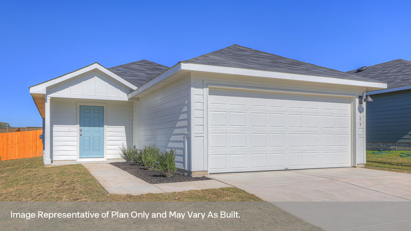 Single-story farmhouse exterior with a 2 car garage.