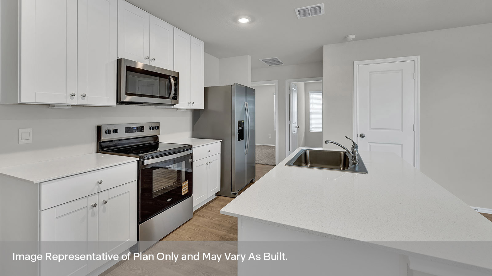 Kitchen with kitchen island and white cabinets.c
