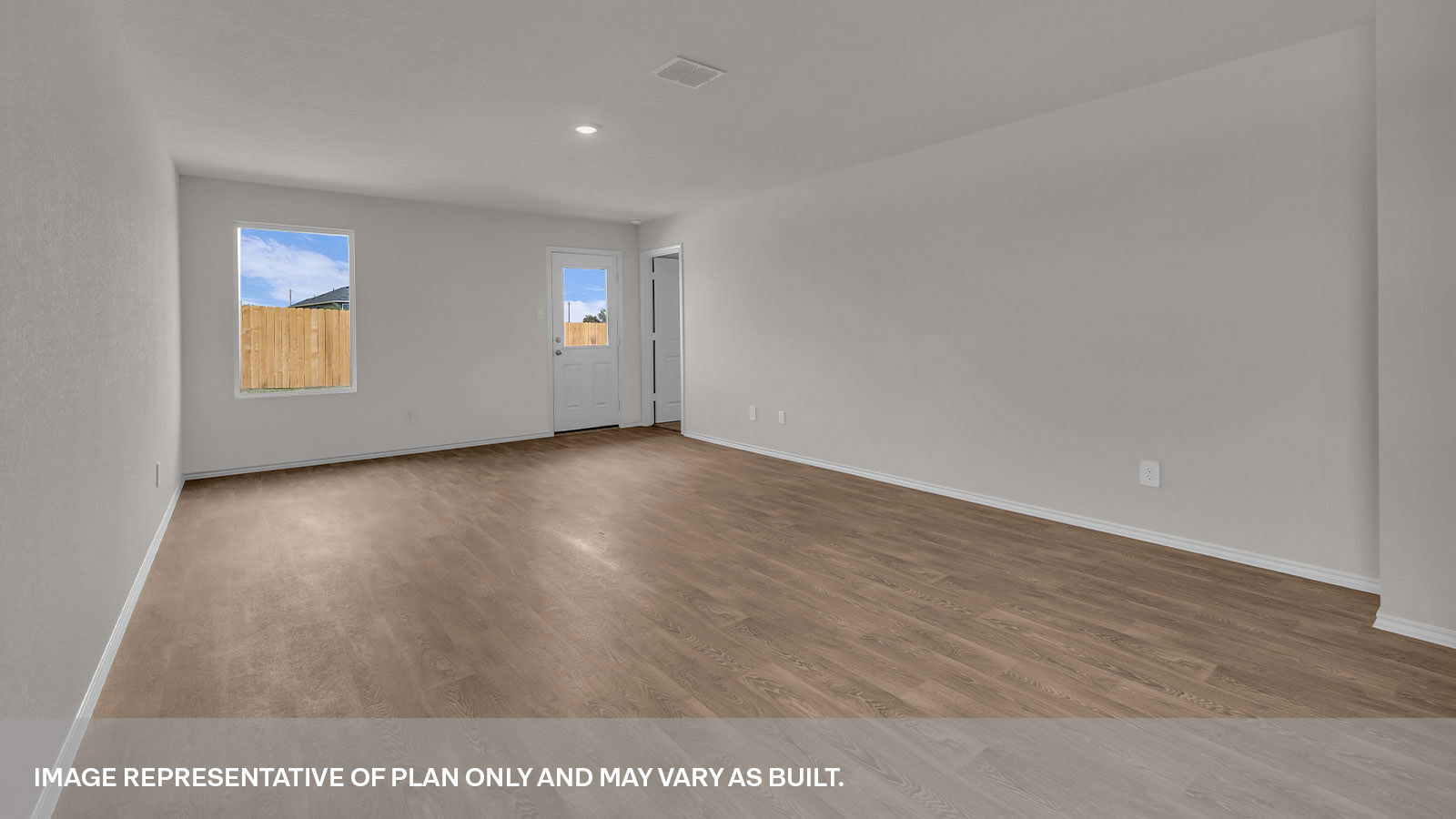 Living room with vinyl flooring, 2 windows, and  half lite exterior door.