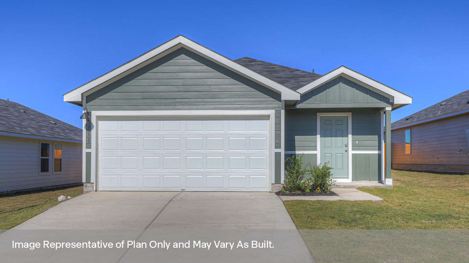 Single-story farmhouse with 2 car garage.