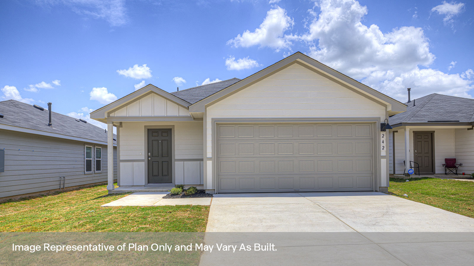 Single-story farmhouse with 2 car garage.