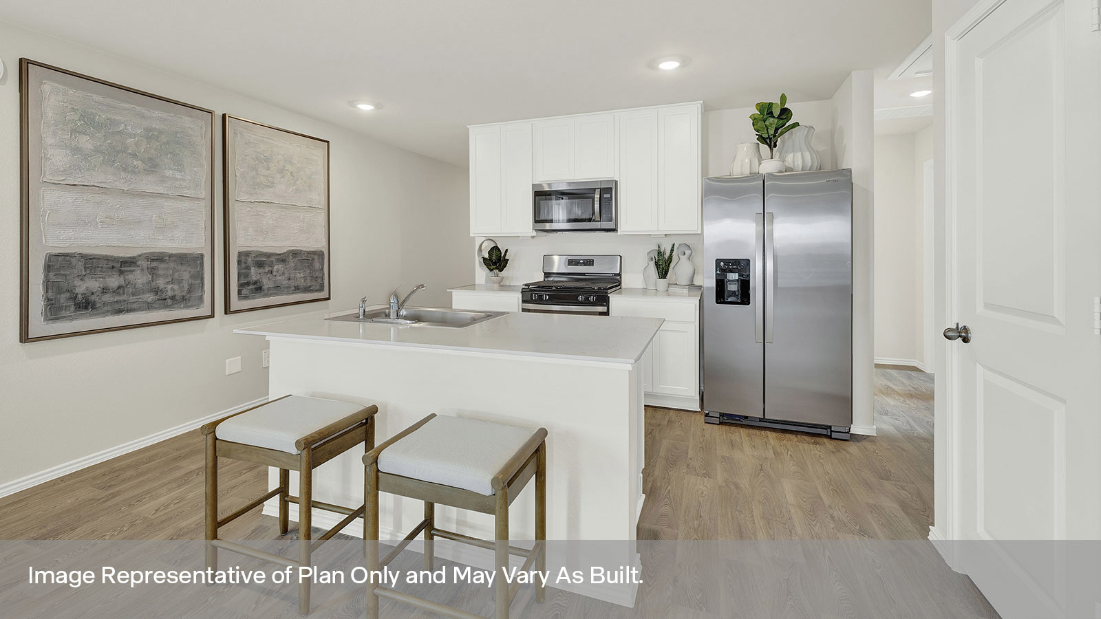 Kitchen with quartz countertops and stainless-steel appliances.