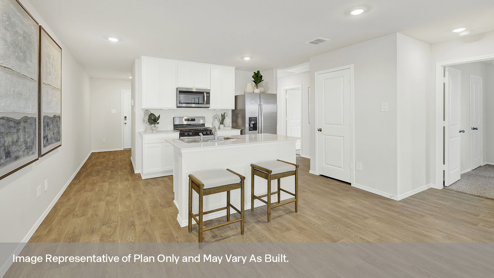 Kitchen with kitchen island and white cabinets and Entry