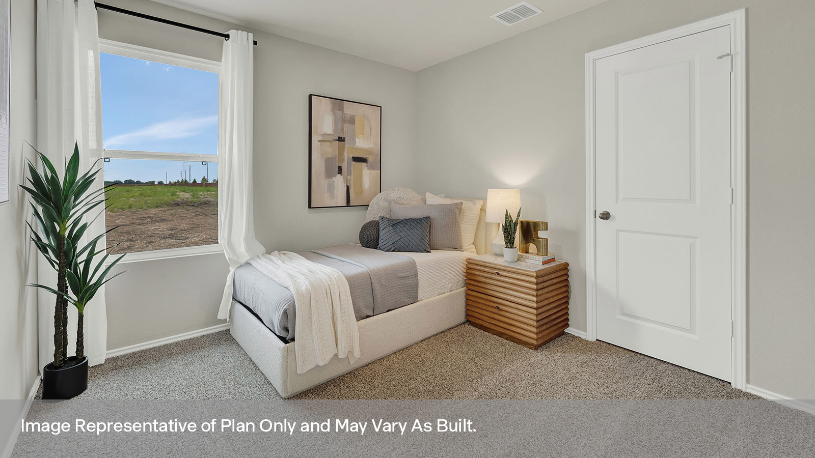 Bedroom with carpeting and one window.