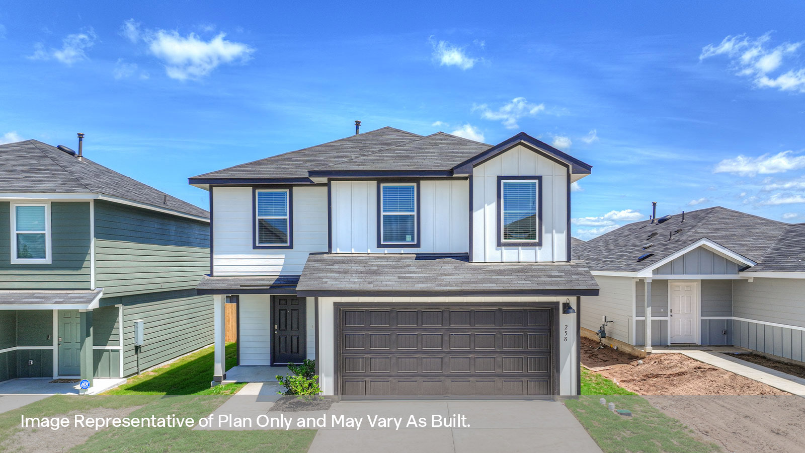Two-story farmhouse exterior photo with 2 car garage.