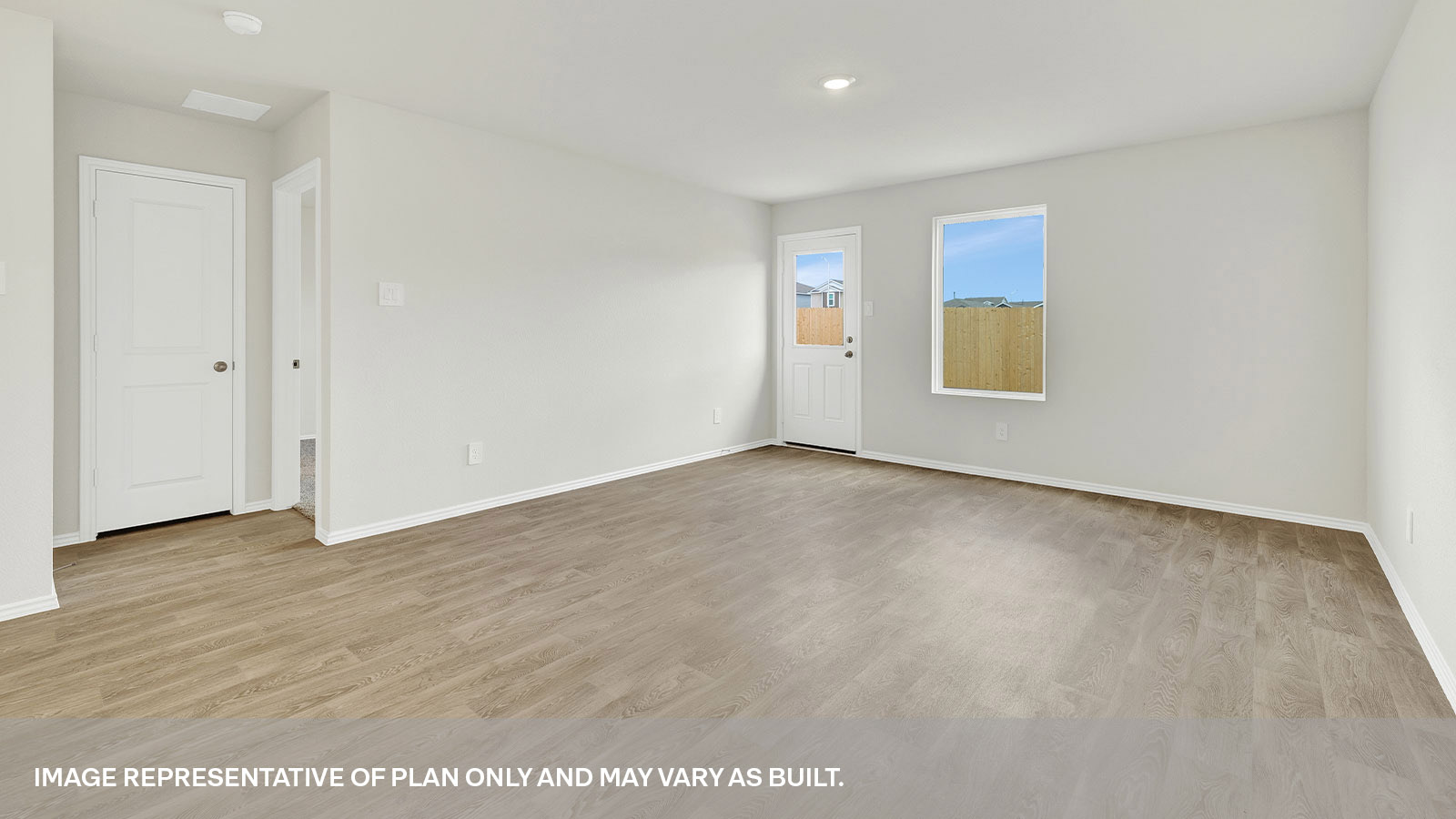 Living room with vinyl flooring, one window, and a half lite exterior door.