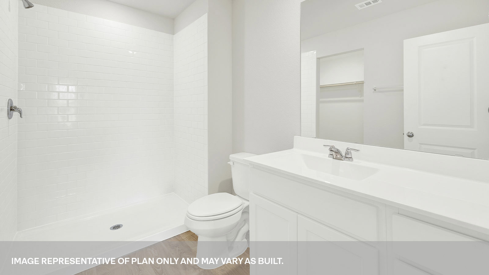 Main bathroom with vanity, toilet, and shower.