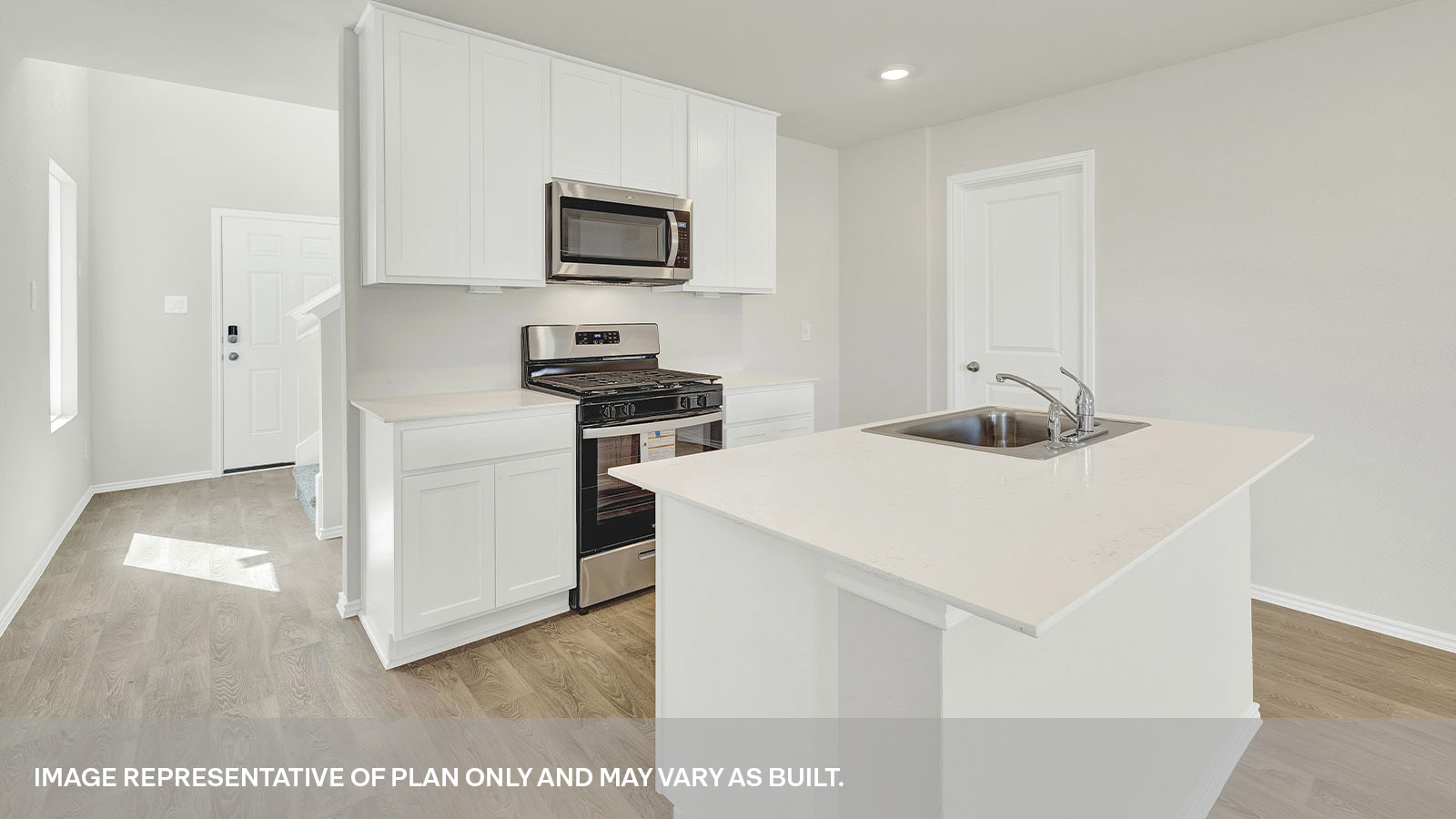 \Kitchen with kitchen island and white cabinets.