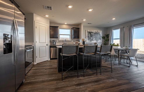 Interior photo of dining room adjacent to kitchen