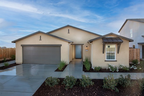 Exterior photo of one story home with two car garage