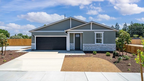 Exterior photo of one story craftsman style model home