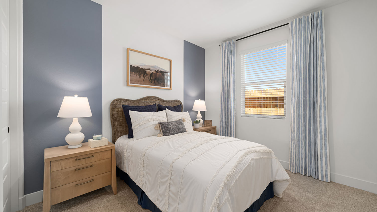 Bedroom with window, plush carpeting, and sliding closet doors