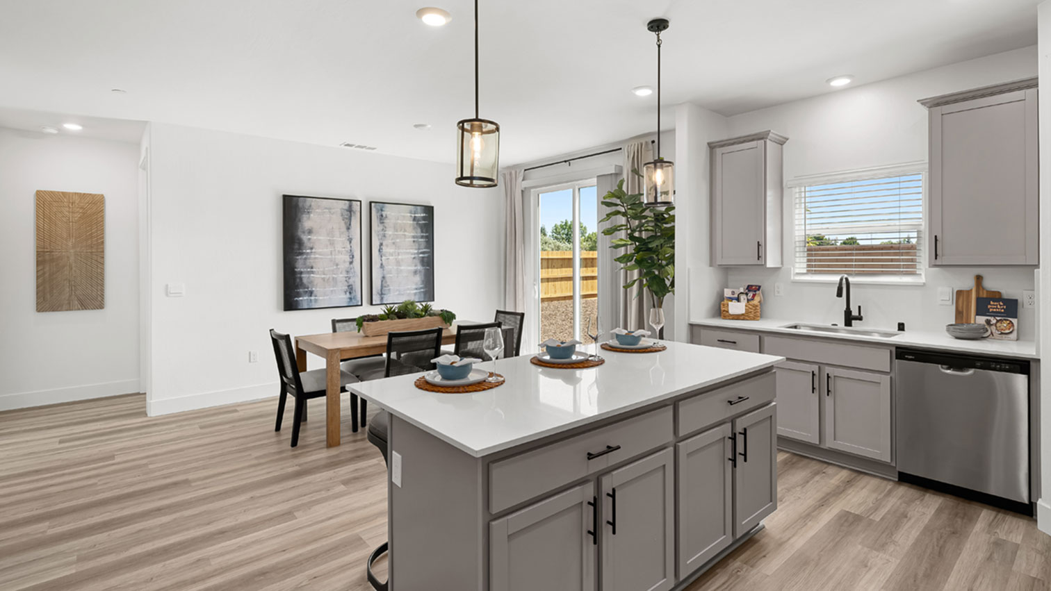 Dining area with large sliding glass door and expansive flooring