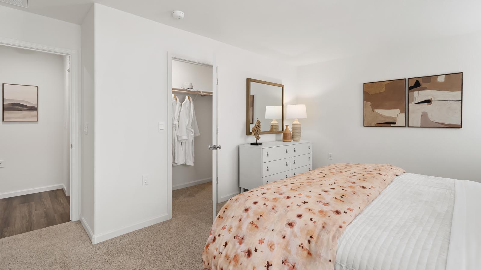 primary bedroom with orange accent wall