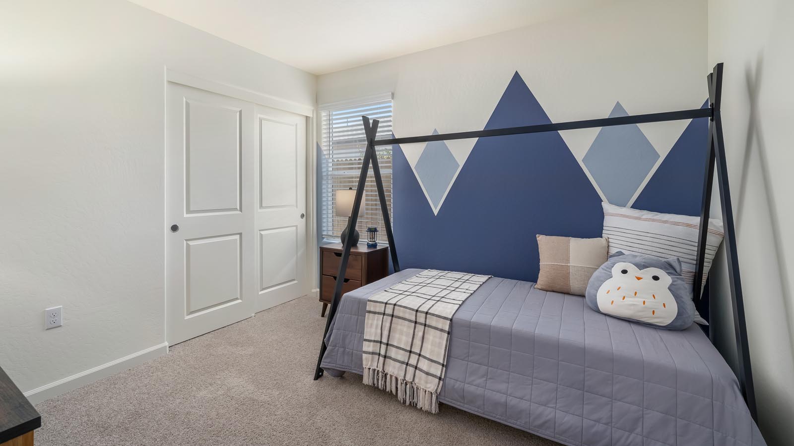 kid's bedroom with mountain mural on wall