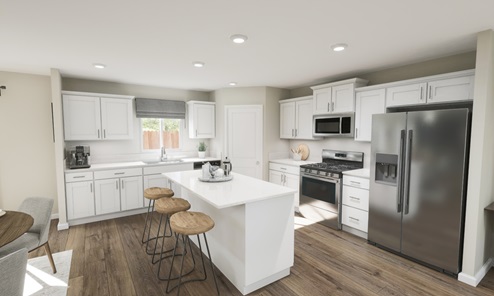 Spacious kitchen with white cabinets and island seating