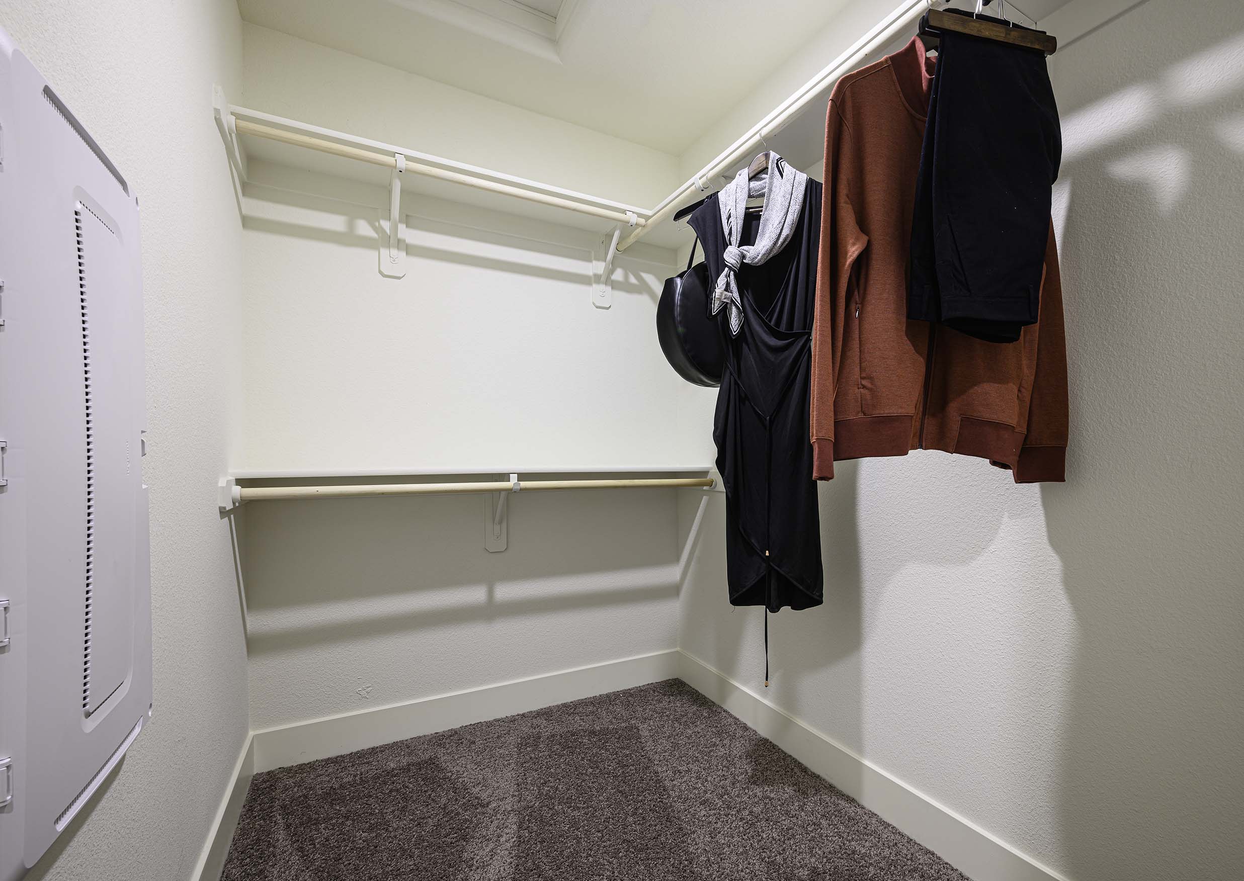 Interior photo of walk in closet connected to primary suite.