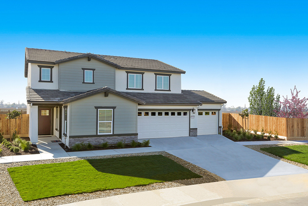 Exterior photo of two story home with three car garage