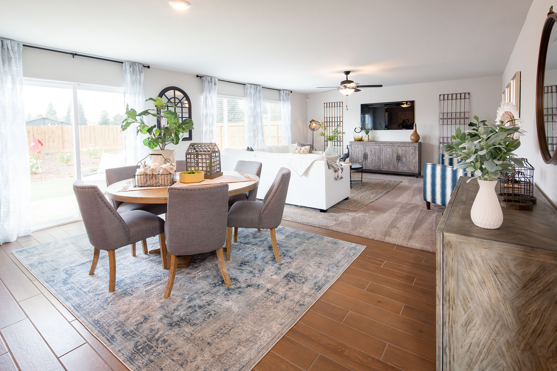 Interior photo of open concept breakfast nook with table, chairs, and rug