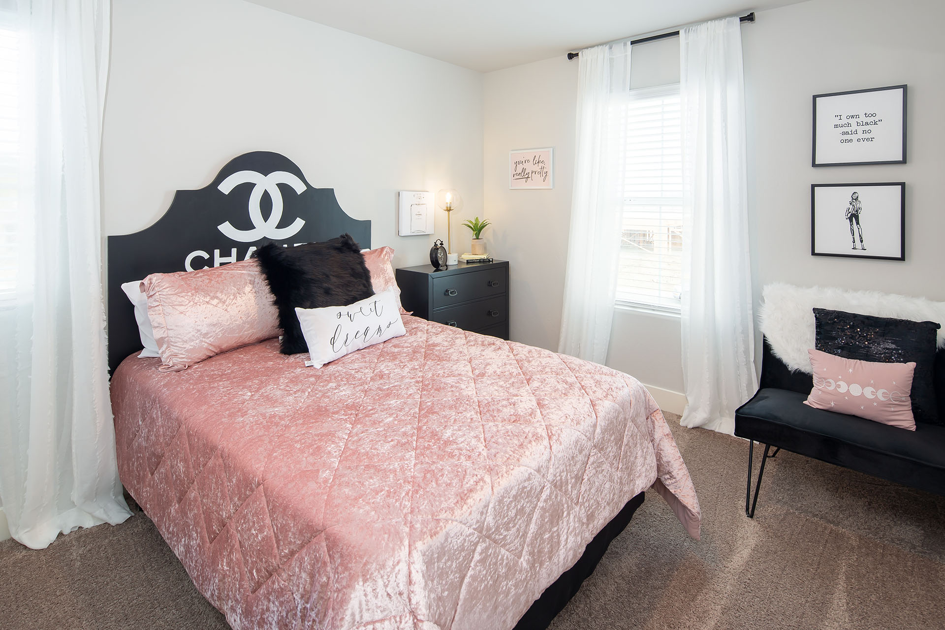 Interior photo of kid's bedroom with end table, chair, and window