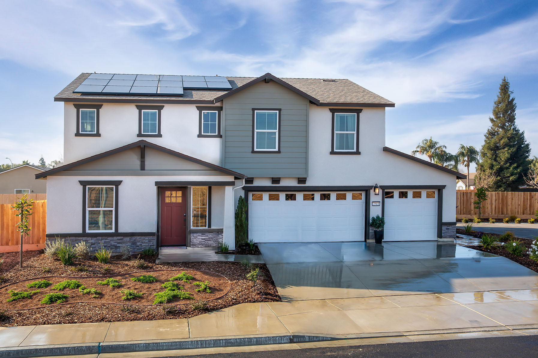 Exterior photo of two story home with three car garage