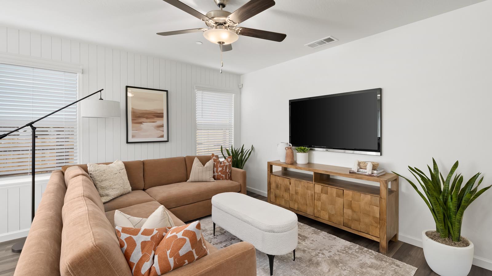 living room with seating and entertainment center