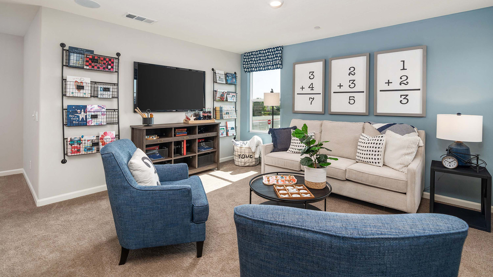 upstairs loft with seating and entertainment center