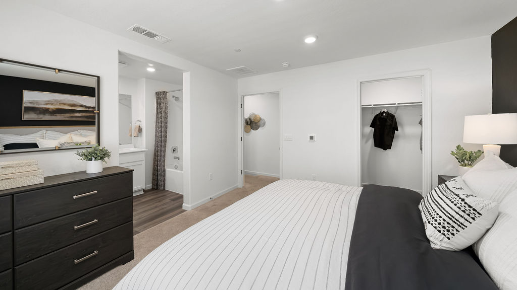 Primary bedroom with black accent wall