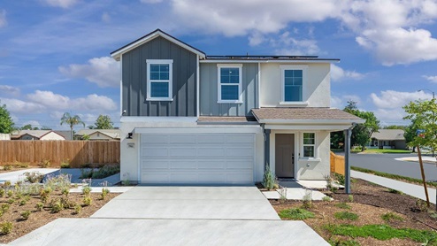 Photo of two story farmhouse style home