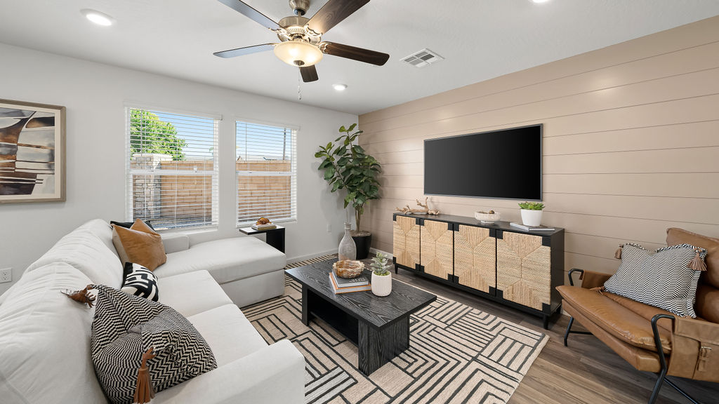 living room with sectional and entertainment center