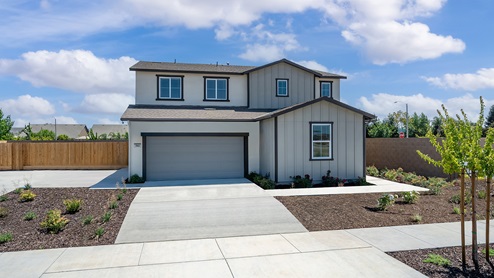 Exterior photo of two story farmhouse style home