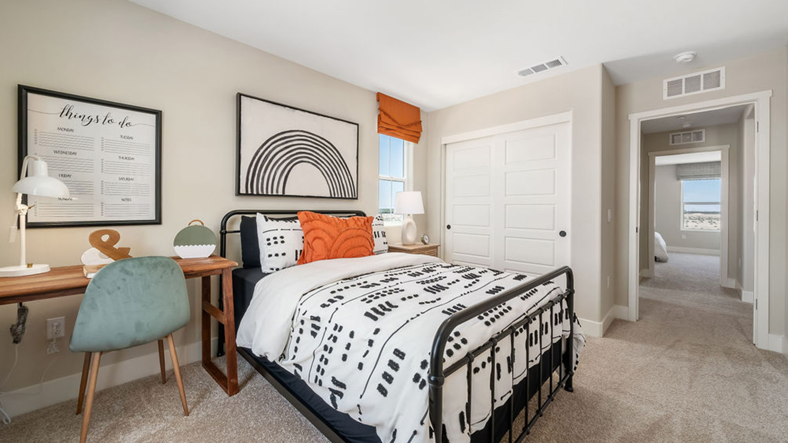 kid's bedroom with bed, desk, and decor