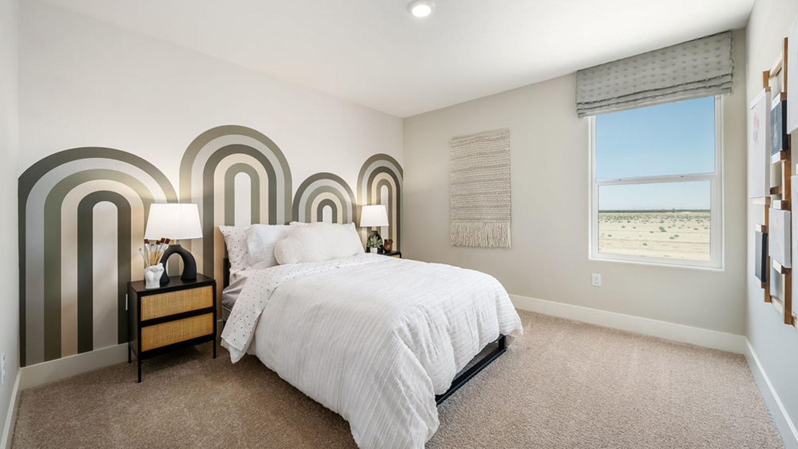 Guest bedroom with green accents on the wall