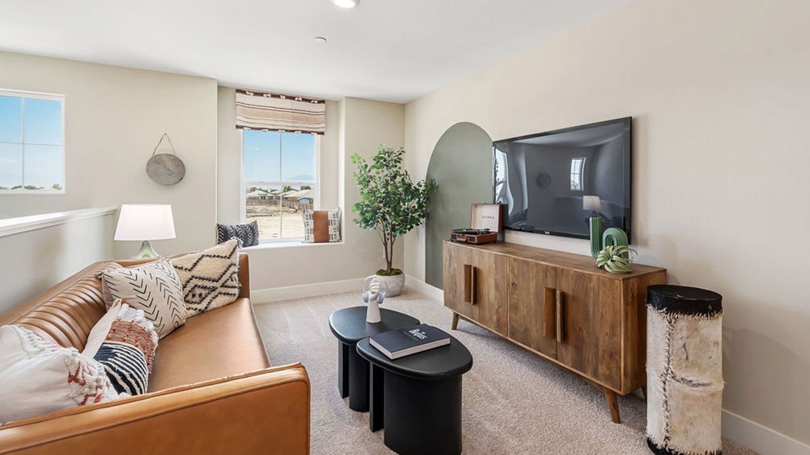 Upstairs loft with seating and entertainment center