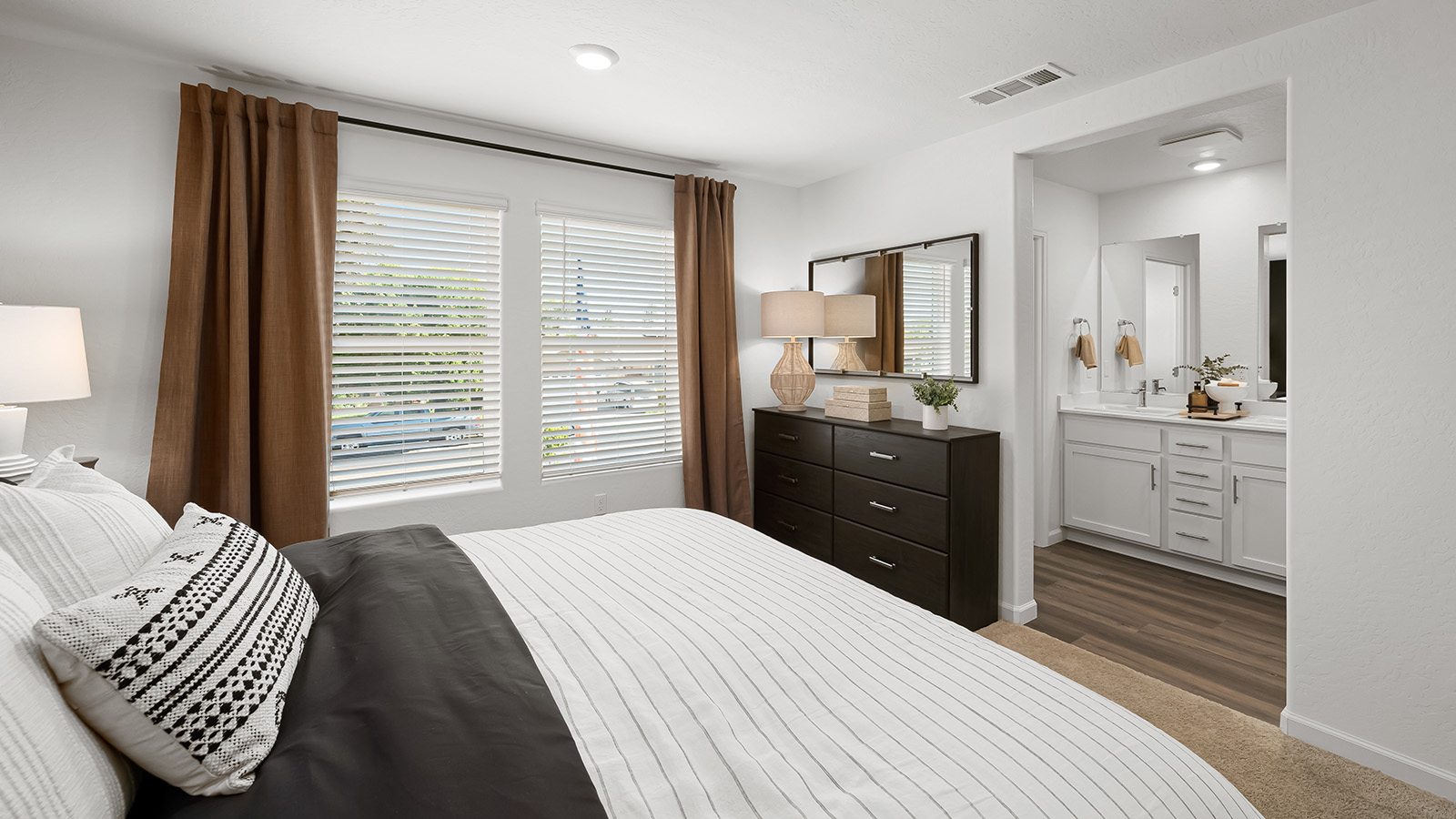 primary bedroom in the oxford plan with view of adjoining bathroom