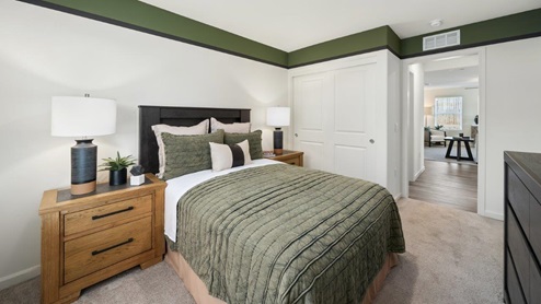 Guest bedroom with full size bed and matching end tables
