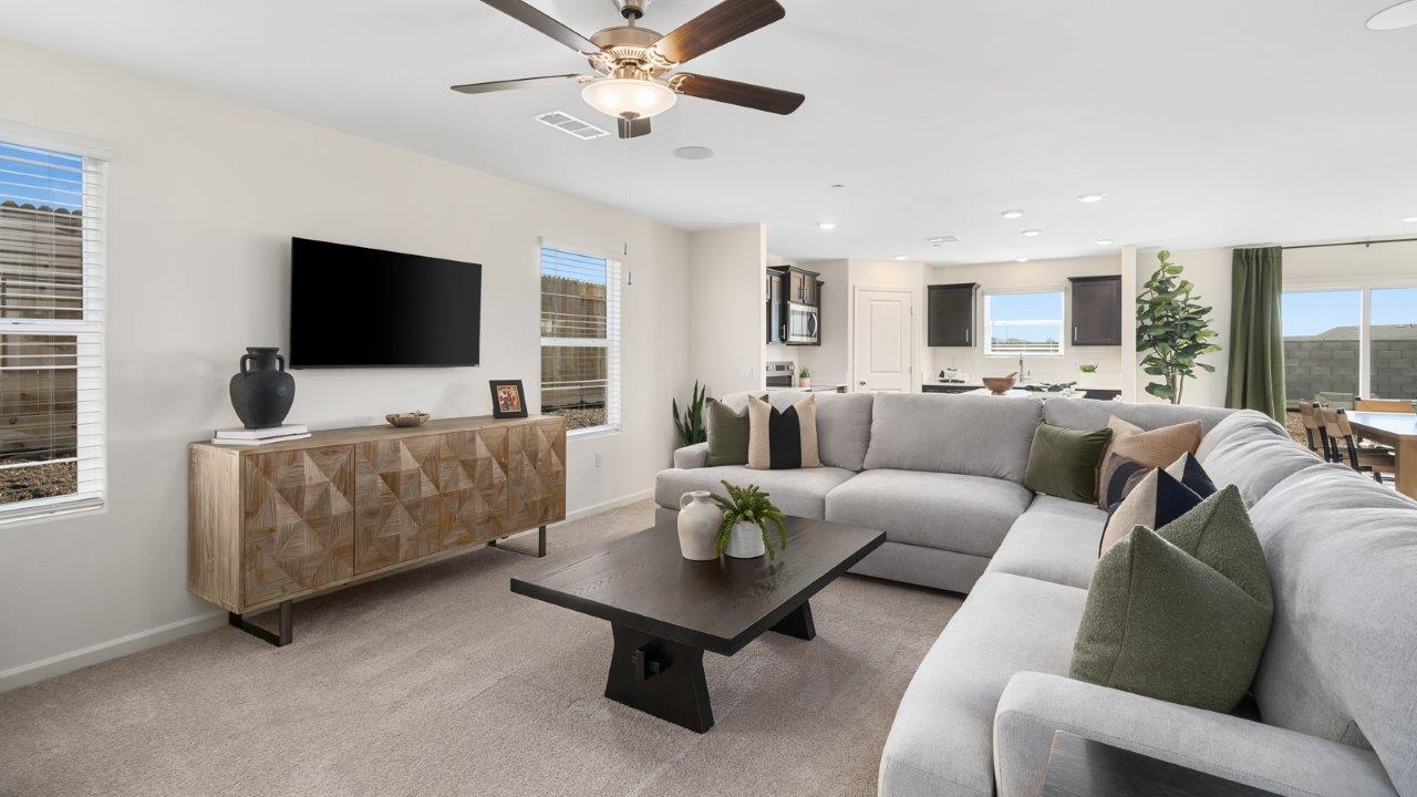 living room with sectional and entertainment center
