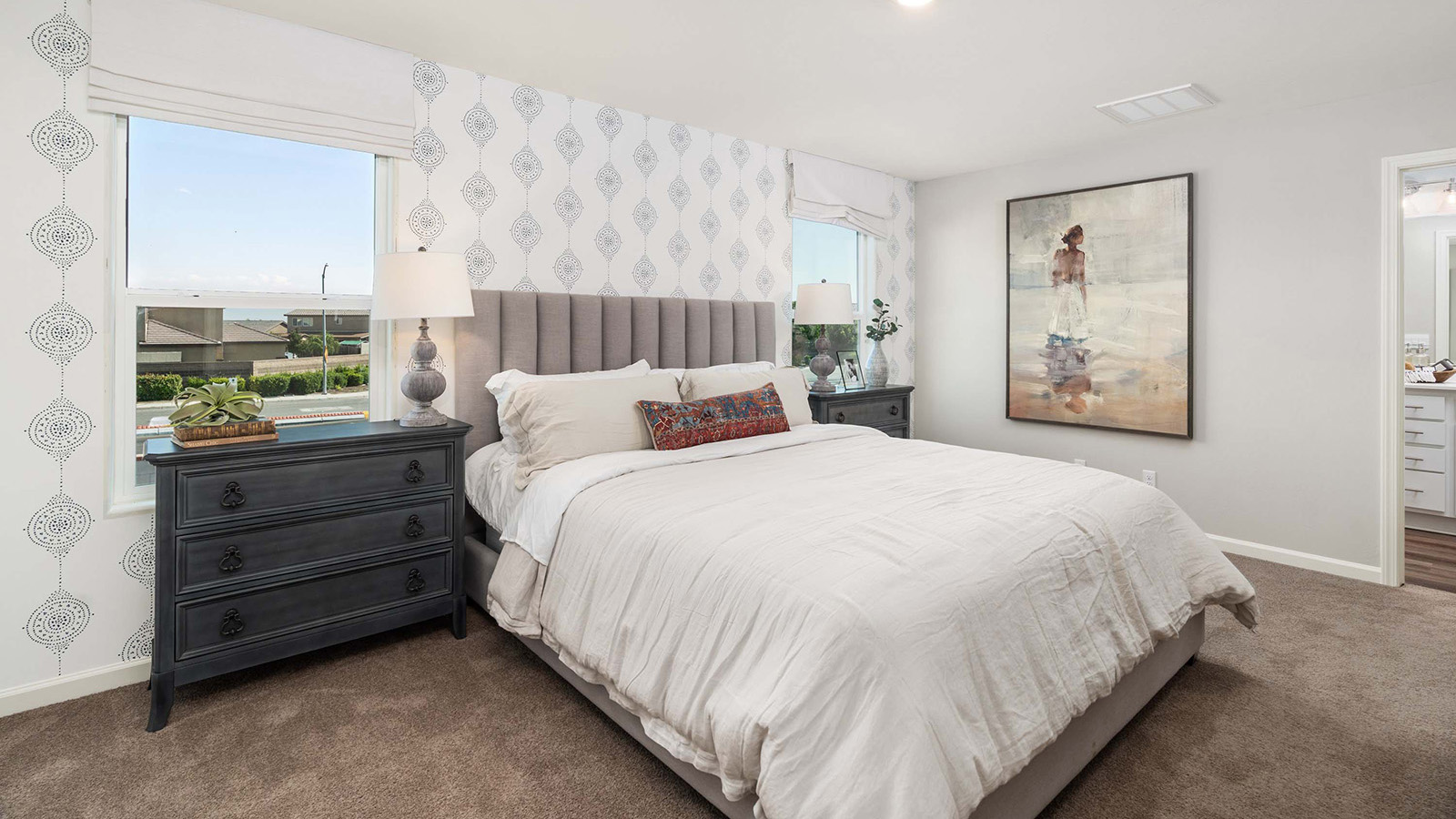 primary bedroom with accent wall